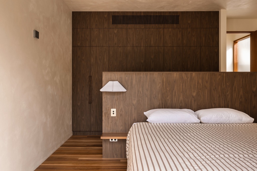 Walnut headboard wall and paper lantern