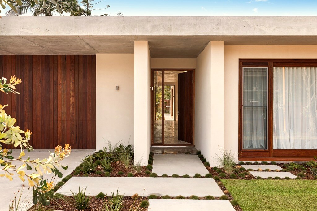 Entry, concrete soffit and timber door
