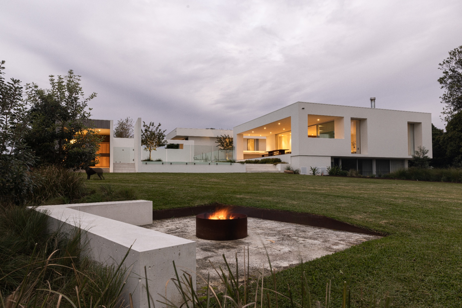 Fire pit and house at dusk