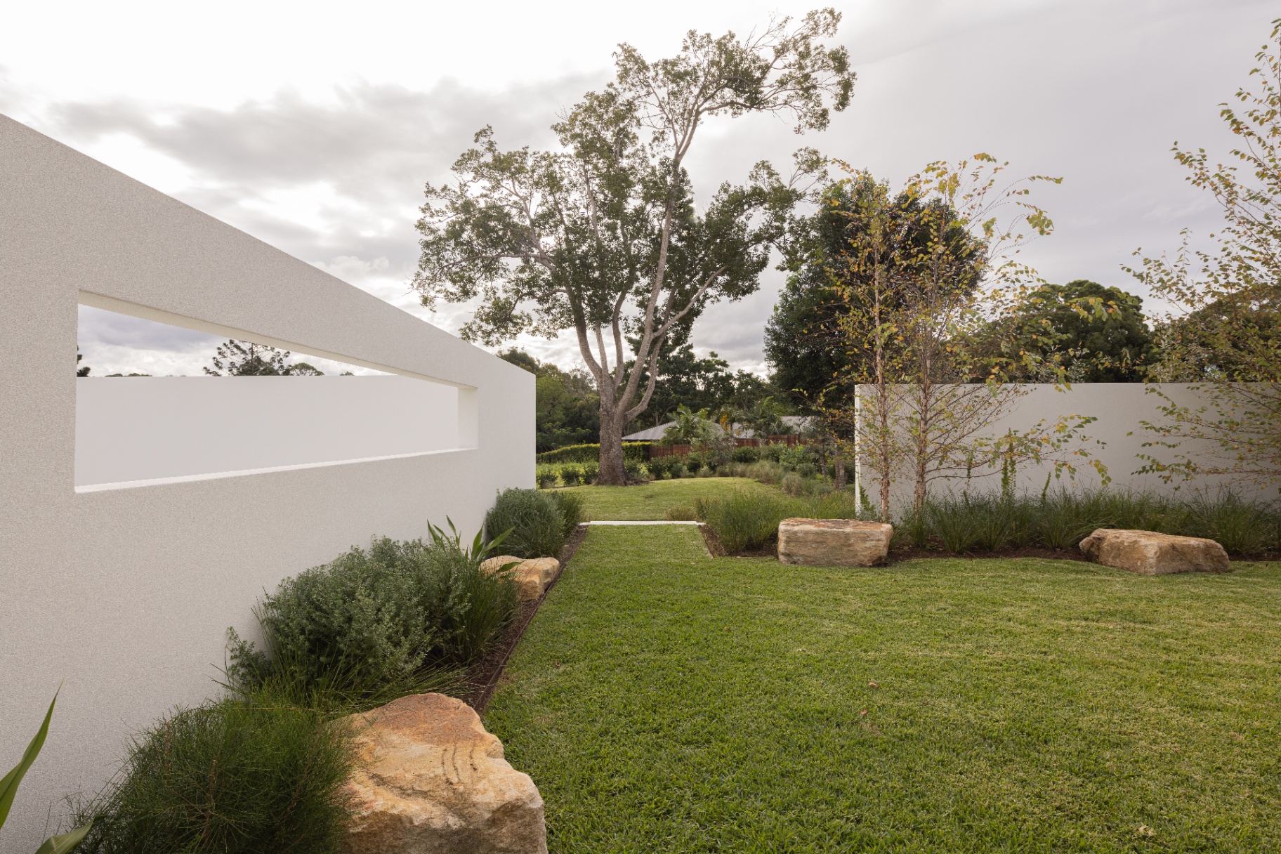 Walled garden — sandstone boulders, native grasses