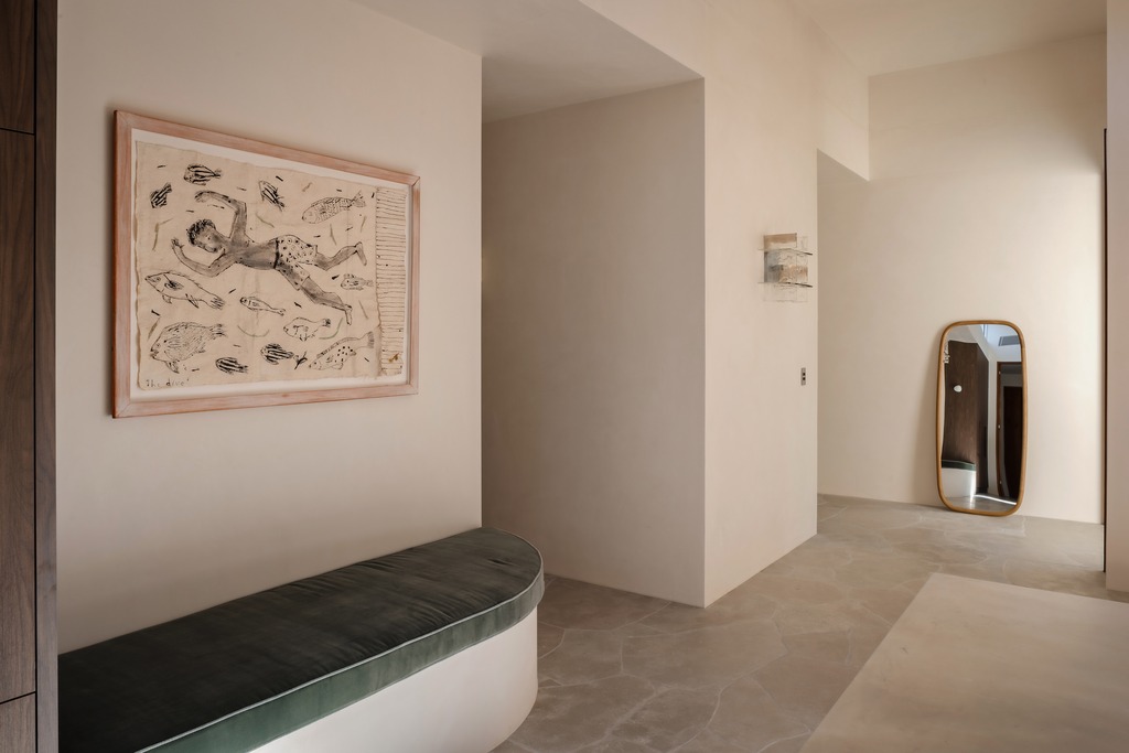 Hallway, velvet bench and artwork