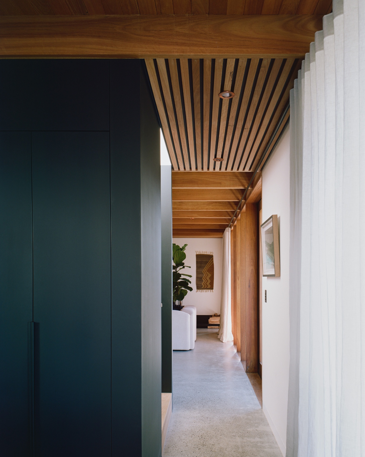 Hallway, green joinery and slat ceiling