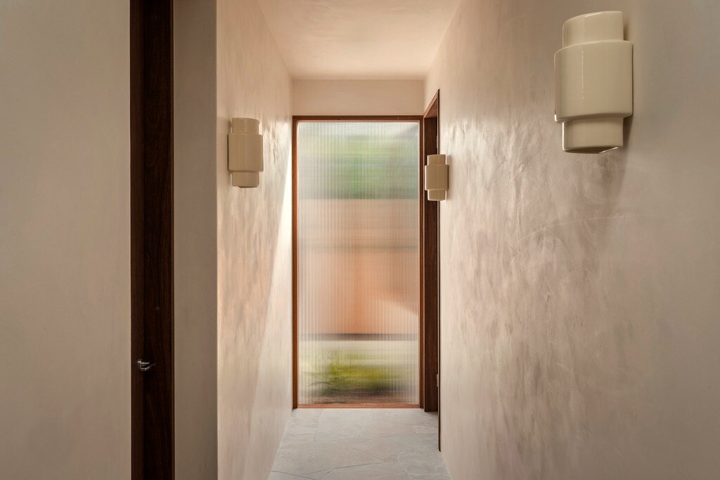 Hallway to courtyard, reeded glass