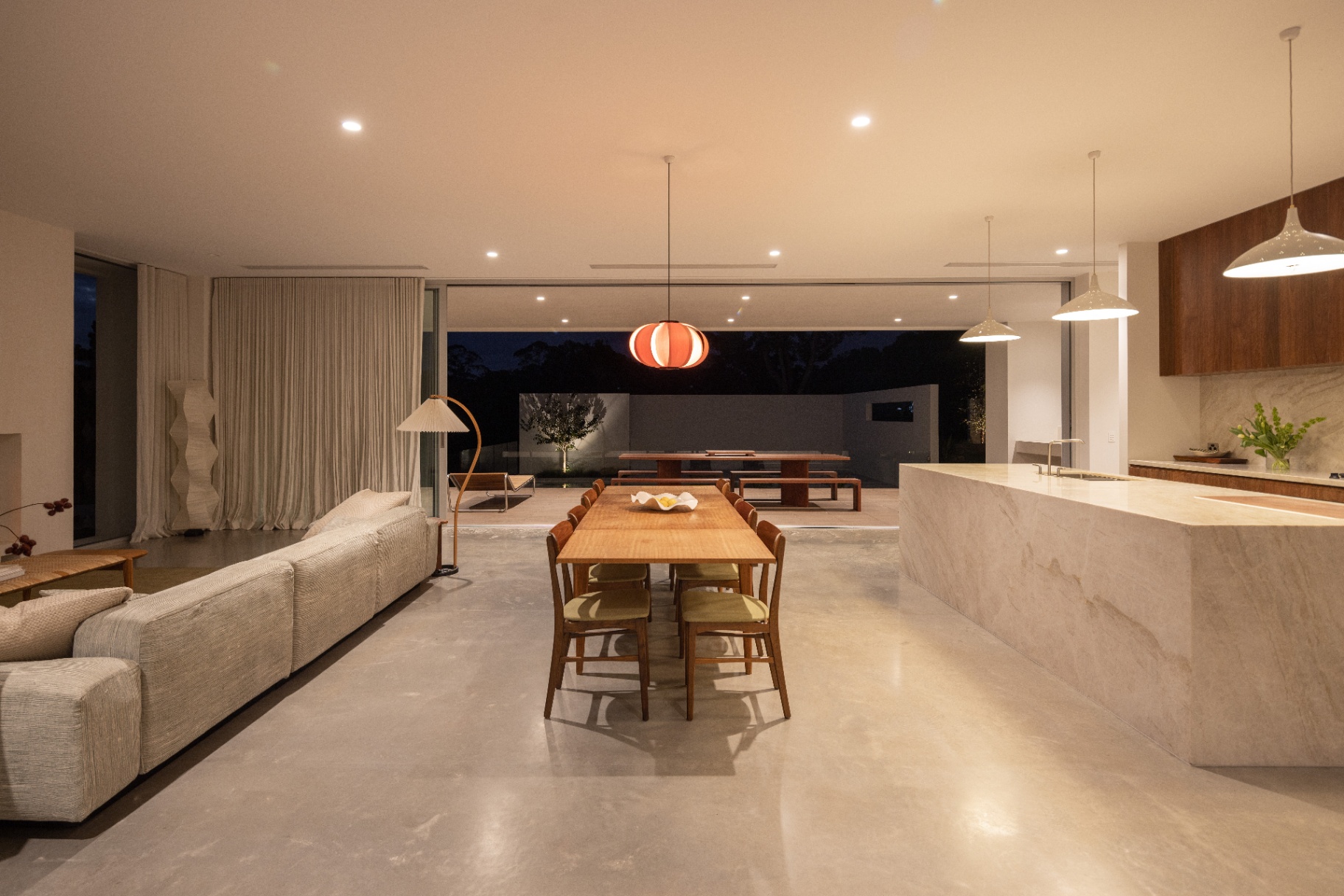 Dining table, island and terrace — night