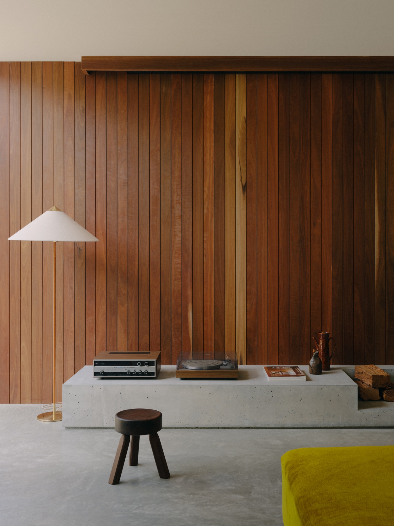 Timber wall and concrete plinth