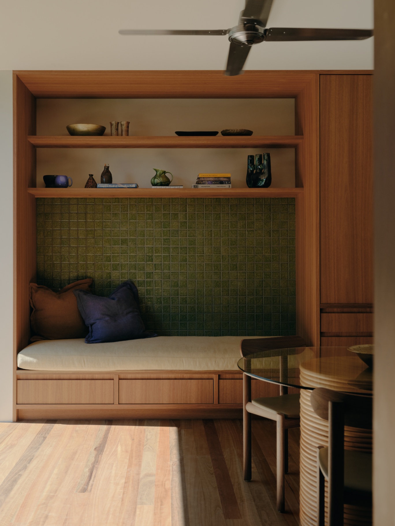 Window seat with green tile backdrop