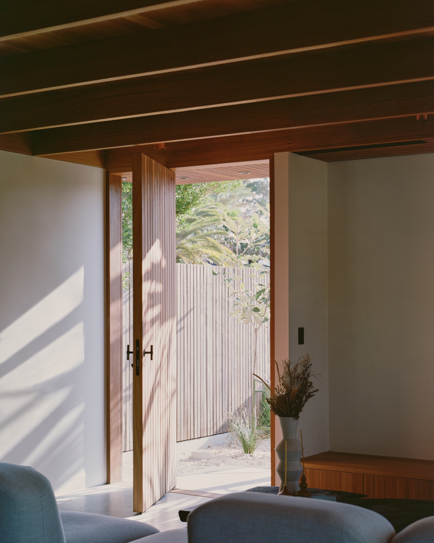 Pivot door open to the courtyard