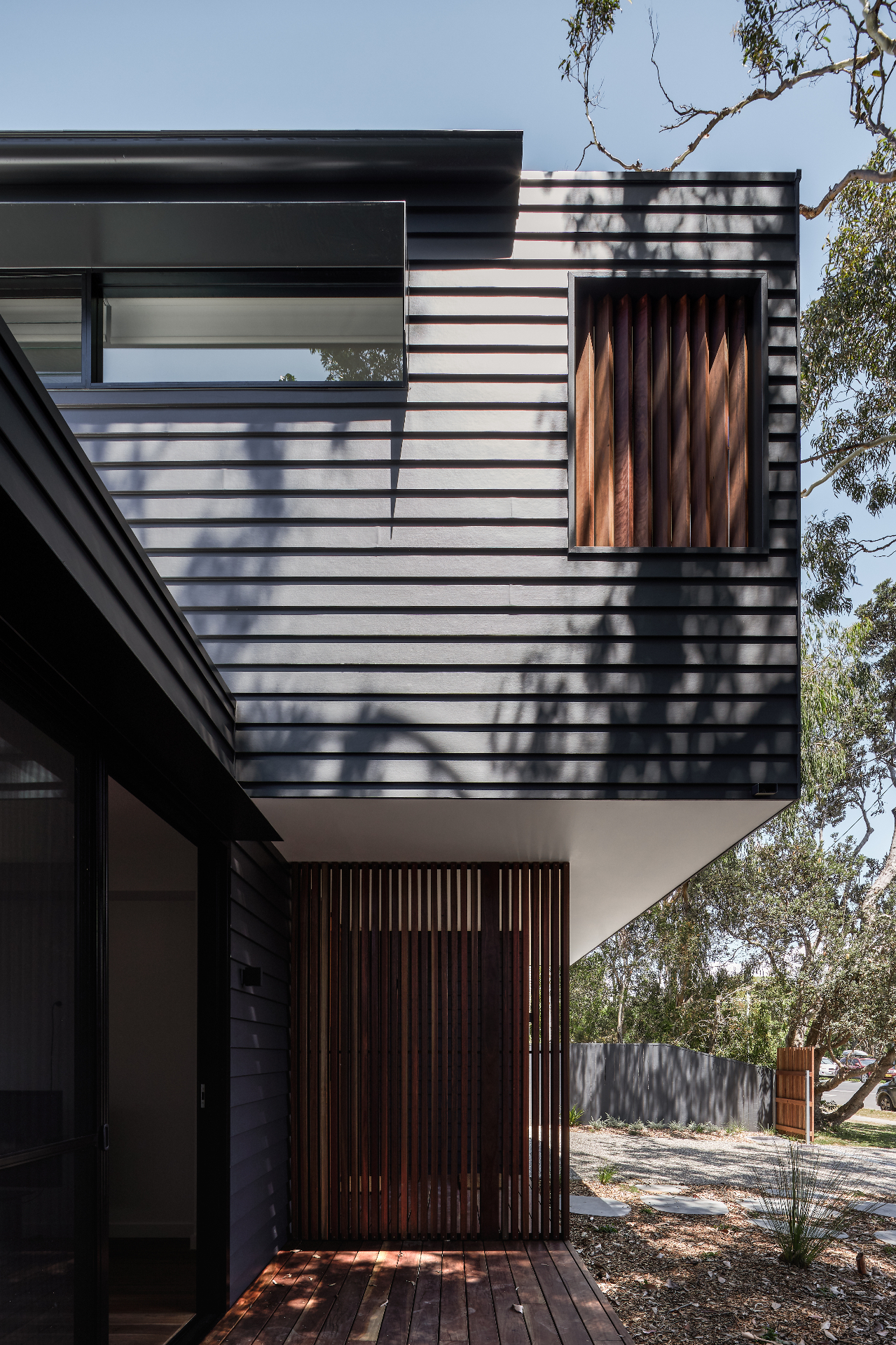 Battened cladding and timber screen