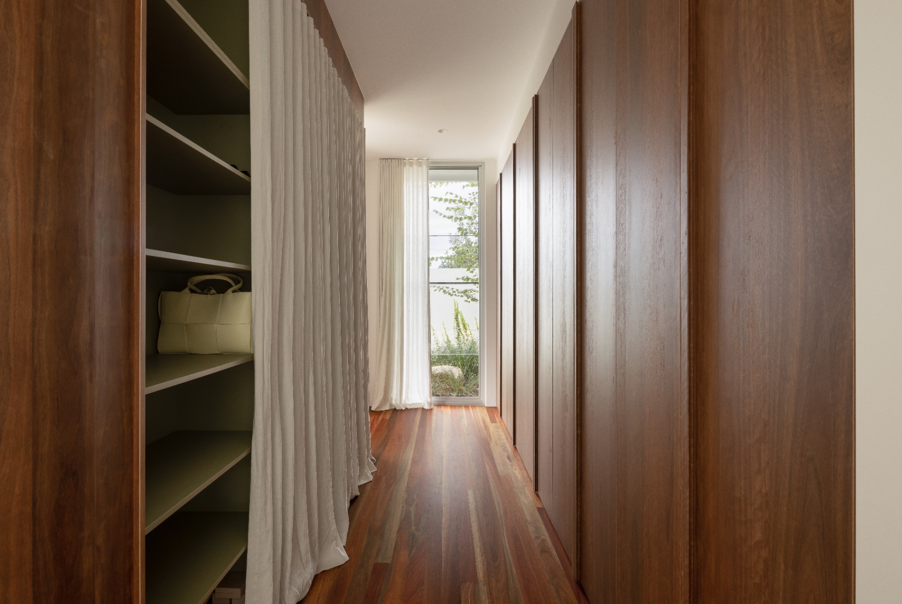Dressing room — walnut joinery, linen curtain